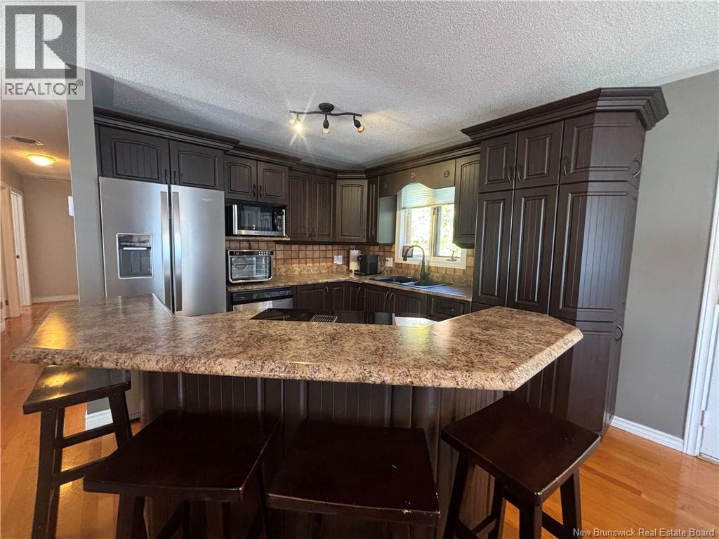 1027 Rue Hache, Beresford, New Brunswick E8K 1H9 - Photo 30 - NB128277